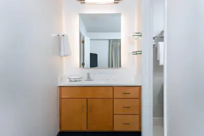 a bathroom with a sink and a mirror at Residence Inn Wayne in Wayne