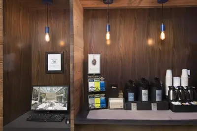 a room with a counter with a laptop on a shelf at Fairfield Inn & Suites by Marriott New York Manhattan/Fifth Avenue in New York