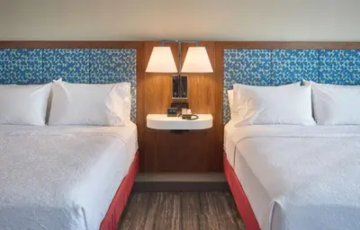a hotel room with two beds and a sink at Hampton Inn by Hilton Harrisburg West in Mechanicsburg