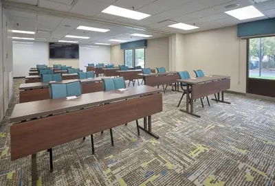 a classroom with desks and chairs in a room at Hampton Inn by Hilton Harrisburg West in Mechanicsburg