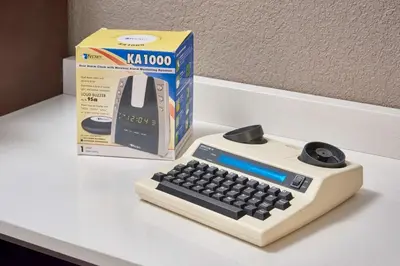 a computer keyboard and a box on a table at Hampton Inn by Hilton Harrisburg West in Mechanicsburg