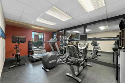 a gym with several treadmills and cardio machines at Hampton Inn & Suites Newtown in Yardley