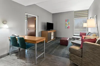 a living room with a table and a couch at Hampton Inn & Suites Newtown in Yardley