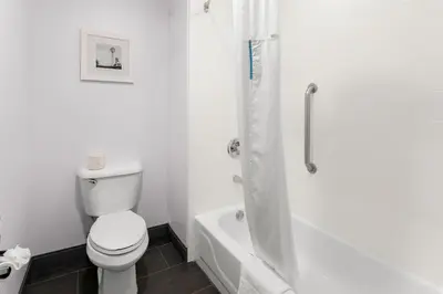 a white bathroom with a toilet and a shower at Hampton Inn & Suites Newtown in Yardley