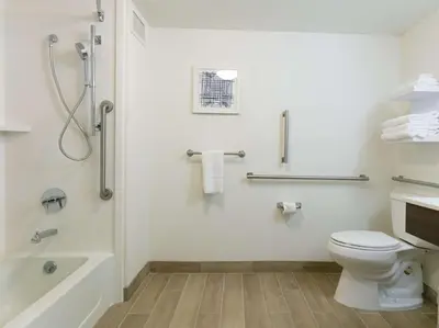 a bathroom with a shower and a toilet and a tub at Hampton Inn Scranton at Montage Mountain in Scranton