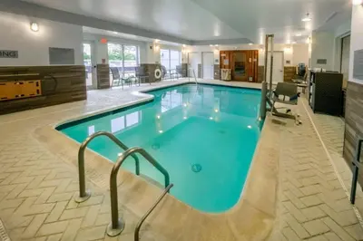 a large pool with blue water in a hotel room at Fairfield Inn by Marriott Hazleton in Hazleton