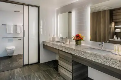 a bathroom with two sinks and a toilet at Carnegie Hotel in New York