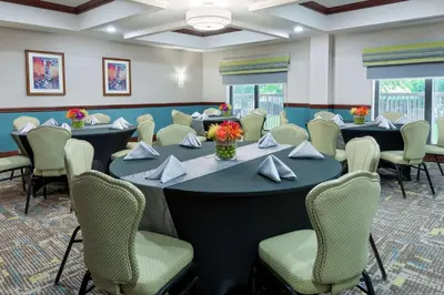 a conference room with a large table and chairs at Hampton Inn South Plainfield-Piscataway in South Plainfield