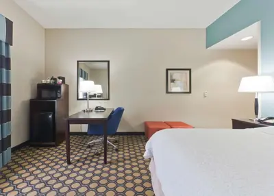 a hotel room with a bed and a desk at Hampton Inn North Brunswick NJ in North Brunswick
