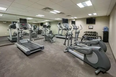 a gym with several treadmills and cardio machines at Residence Inn by Marriott Hazleton in Hazleton