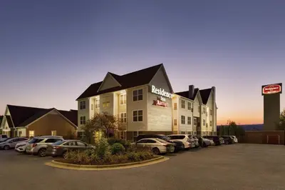 a hotel with cars parked in a parking lot at Residence Inn Scranton in Scranton