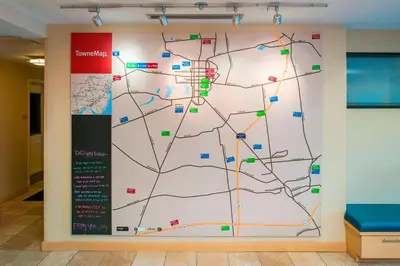a map on a wall in a hallway at TownePlace Suites by Marriott Bethlehem Easton/Lehigh Valley in Hollo