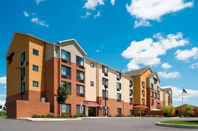 a row of apartment buildings on a street at TownePlace Suites by Marriott Bethlehem Easton/Lehigh Valley in Hollo