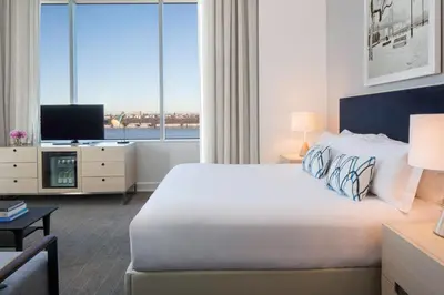 a hotel room with a bed and a large window at Ink 48 Hotel in New York