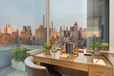 an office with a desk with a view of the city at Ink 48 Hotel in New York