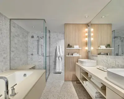 a bathroom with a tub and a sink and a shower at Smyth Tribeca in New York