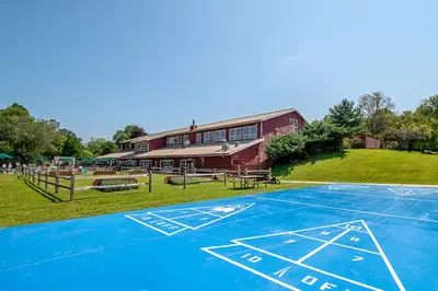a basketball court in front of a building at Hershey Camping Resort Park Model 6 in Mount Wilson