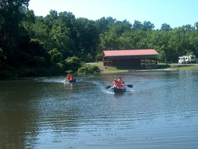 two people are in kayaks on a river at Hershey Camping Resort Loft Park Model 7 in Mount Wilson