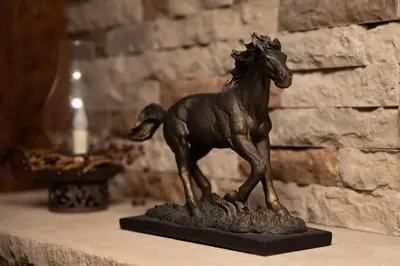 a bronze statue of a horse on a table at Carriage House Country Club in Pocono Manor