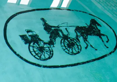 a reflection of two horses on a glass table at Carriage House Country Club in Pocono Manor