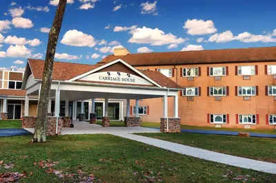 a building with a sign that reads campus halls at Carriage House Country Club in Pocono Manor