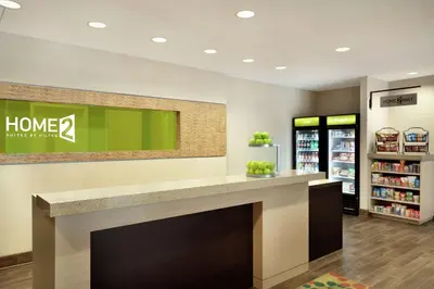 a lobby of a home store with a fireplace at Home2 Suites by Hilton Middletown in Middletown