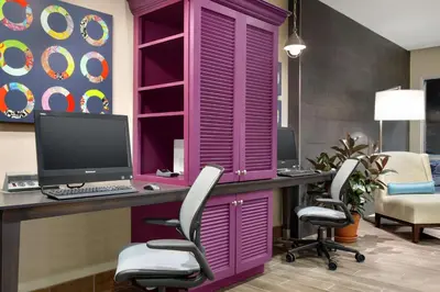 an office with a purple desk with a computer on it at Home2 Suites by Hilton Middletown in Middletown