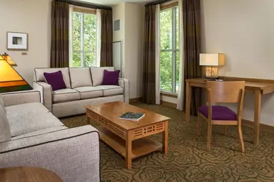 a living room with a couch and a table at The Inn At Swarthmore in Swarthmore