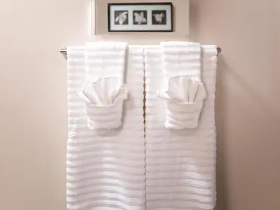 a group of towels hanging on a towel rack at Fantastic Philly Fully Furnished Apartments in Philadelphia