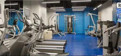 a gym with several treadmills and cardio machines at Fantastic Philly Fully Furnished Apartments in Philadelphia