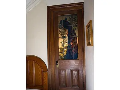 a wooden door in a room with a picture on it at The Inn at Centre Park in Reading
