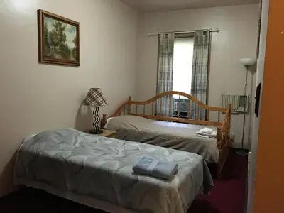 a bedroom with two beds and a window at Beauty Near Times Square in New York