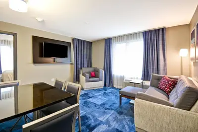 a living room with a couch and a table at TownePlace Suites by Marriott Dover Rockaway in Dover