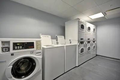 a laundry room with a washer and dryer at TownePlace Suites by Marriott Dover Rockaway in Dover