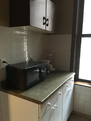 a microwave sitting on a counter in a kitchen at Times Square Perfect Home in New York