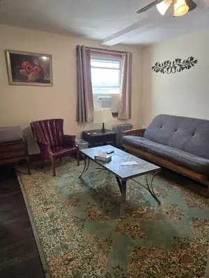 a living room with a couch and a coffee table at Lakewood Lodge & Restaurant in Lakewood