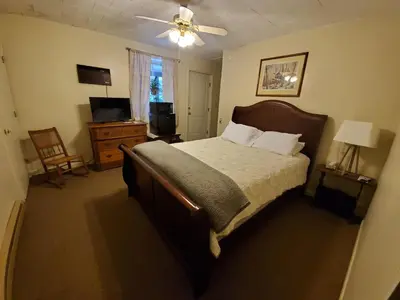 a bedroom with a bed and a ceiling fan at Lakewood Lodge & Restaurant in Lakewood