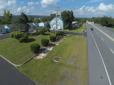 a house on the side of a road next to a street at Cottage Inn - Grantville in Grantville