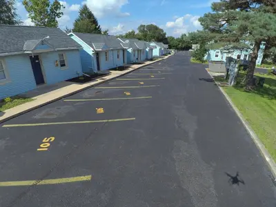 an empty street with a row of houses at Cottage Inn - Grantville in Grantville