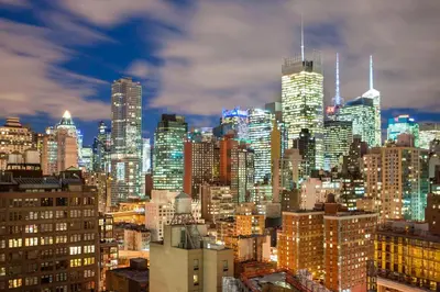 a view of a city skyline at night at Four Points by Sheraton Manhattan Midtown West in New York