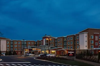 a large building with a street in front of it at Residence Inn by Marriott Philadelphia Glen Mills/Concordville in Glen Mills