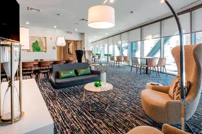 a lobby with couches and chairs and a table at Residence Inn by Marriott Jersey City in Jersey City