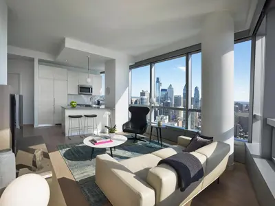 a living room with a couch and a table at AKA University City in Philadelphia