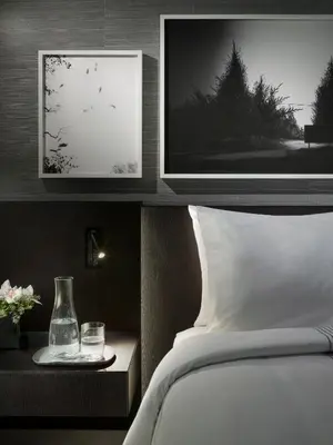 a bedroom with a bed and a picture on the wall at AKA University City in Philadelphia