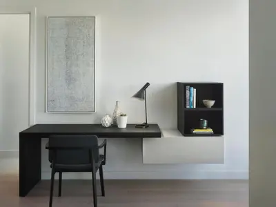 a black desk with a chair and a lamp at AKA University City in Philadelphia
