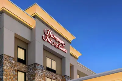 a sign on the side of a holiday inn singapore at Hampton Inn & Suites Mount Joy/Lancaster West, Pa in Manheim