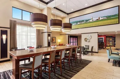 a large dining room with a long table and chairs at Hampton Inn & Suites Mount Joy/Lancaster West, Pa in Manheim