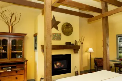 a living room with a fireplace in a room at Woolverton Inn in Stockton