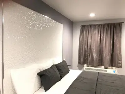 a bedroom with a large bed and a window at Ramsey Inn & Suites in Ramsey