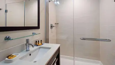 a bathroom with a sink and a shower at Best Western Plus Philadelphia Convention Center Hotel in Philadelphia